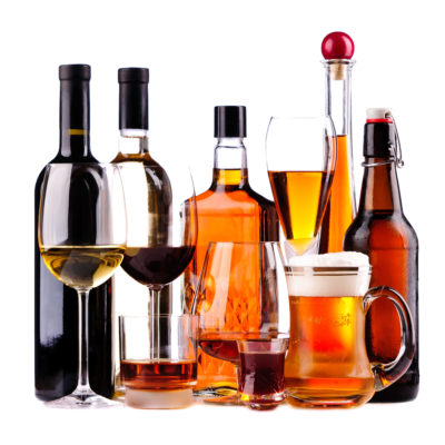 Different alcoholic drinks different bottles and glasses of alcoholic drinks isolated on a white background